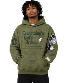 Person wearing a green hoodie with text and graphics on a gray background