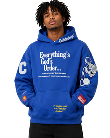 Person wearing a blue hoodie with text and logos on a gray background