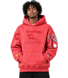 Person wearing a red hoodie with text and graphics on a gray background