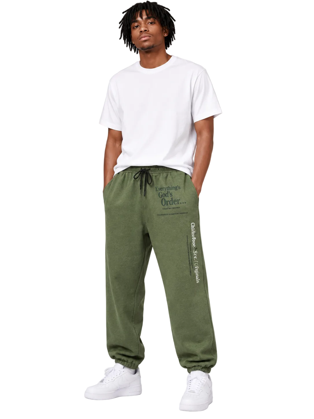 Person wearing green jogger pants with text and a white t-shirt on a light gray background