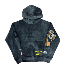 Acid Black hoodie with embroidered designs and text on a white background