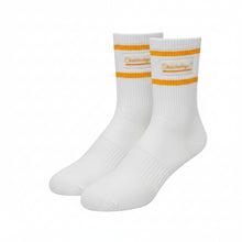 A pair of off-white athletic crew socks with two vertical orange stripes and an orange logo on the cuffs, displayed against a plain white background.